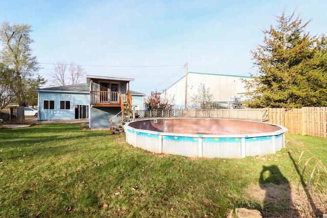 view of pool featuring a yard and a deck