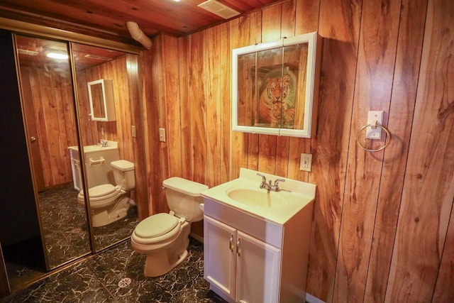 bathroom with vanity, wooden walls, toilet, and wood ceiling