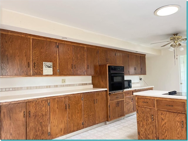 kitchen featuring black appliances and ceiling fan