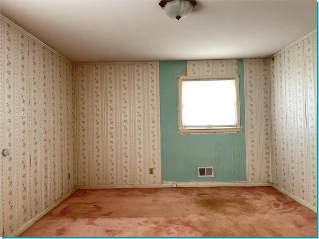 unfurnished room with carpet flooring and ornamental molding