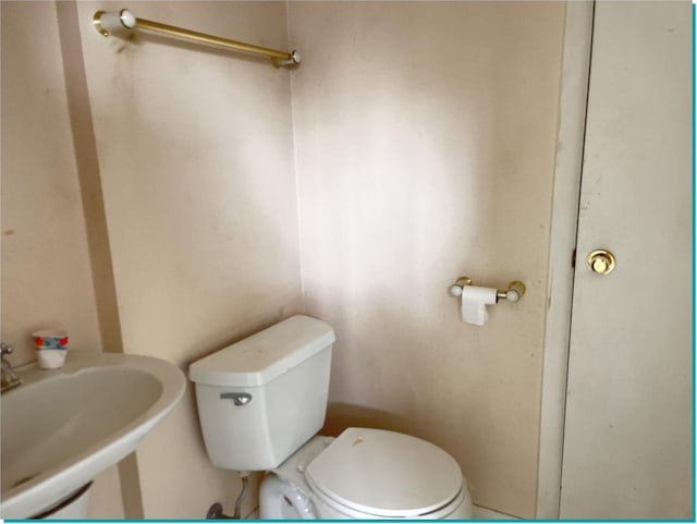 bathroom with sink and toilet