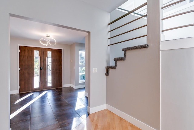 4720 Sumac Rd, Middleton, WI 53562 - entrance foyer featuring a chandelier, stairway, french doors, and tile patterned floors