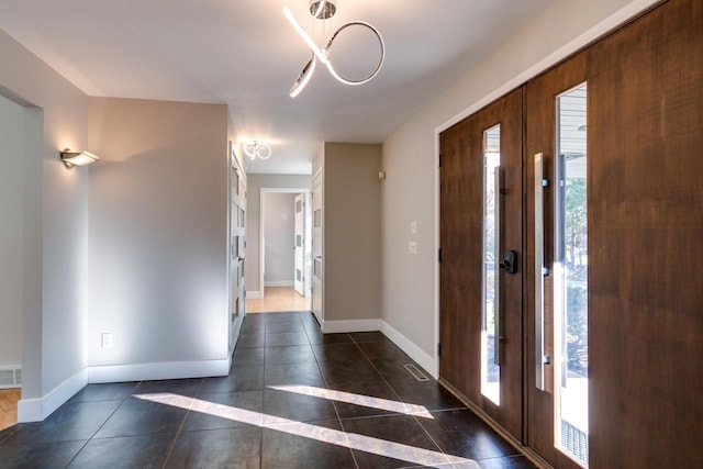 4720 Sumac Rd, Middleton, WI 53562 - foyer entrance with tile patterned floors, french doors, and a chandelier