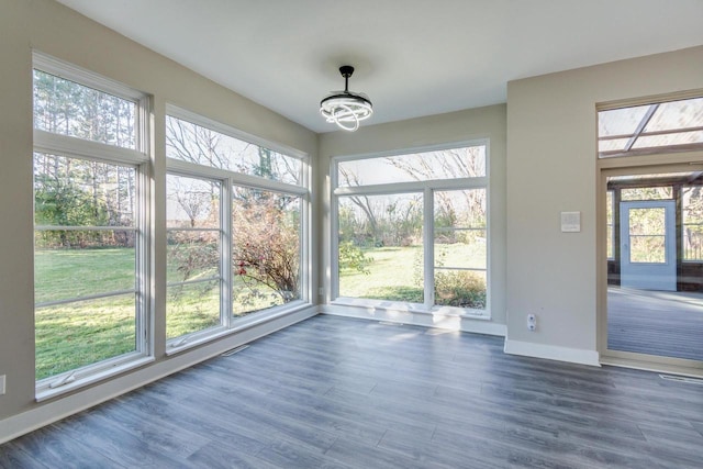 4720 Sumac Rd, Middleton, WI 53562 - unfurnished sunroom with wood finished floors and a chandelier
