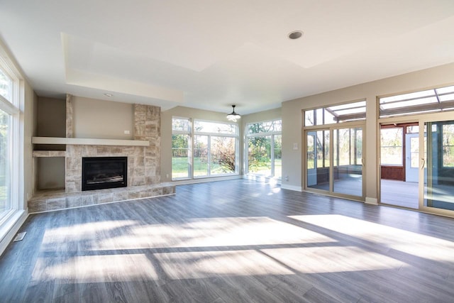 unfurnished living room with a fireplace and wood-type flooring