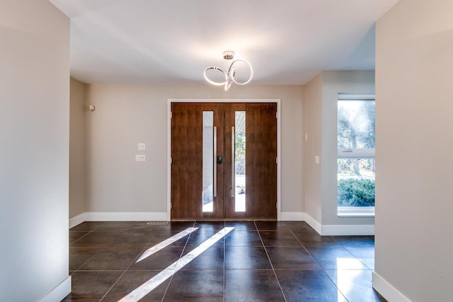 4720 Sumac Rd, Middleton, WI 53562 - tiled foyer with a chandelier and french doors
