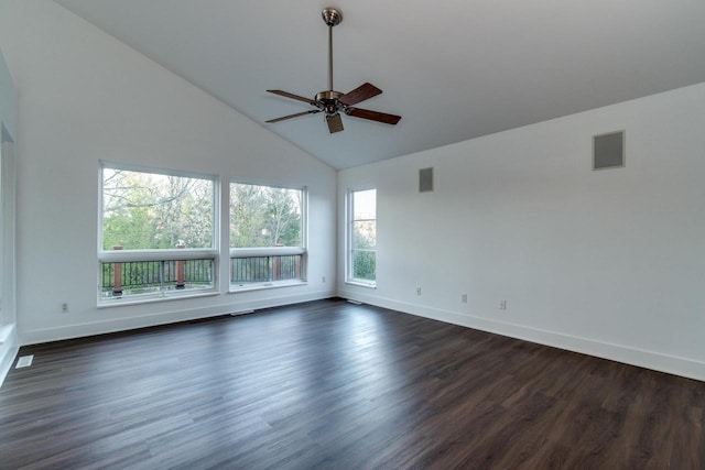 unfurnished room with dark hardwood / wood-style floors, high vaulted ceiling, a wealth of natural light, and ceiling fan