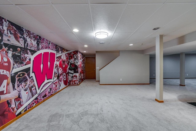 playroom featuring carpet flooring and a drop ceiling