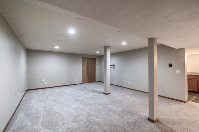 basement with light colored carpet