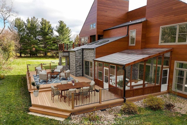 4720 Sumac Rd, Middleton, WI 53562 - rear view of house with a chimney, a sunroom, a balcony, a deck, and a lawn