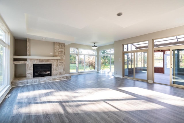 4720 Sumac Rd, Middleton, WI 53562 - unfurnished living room with healthy amount of natural light, wood finished floors, a fireplace, and recessed lighting