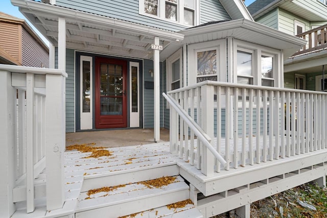 view of exterior entry with covered porch