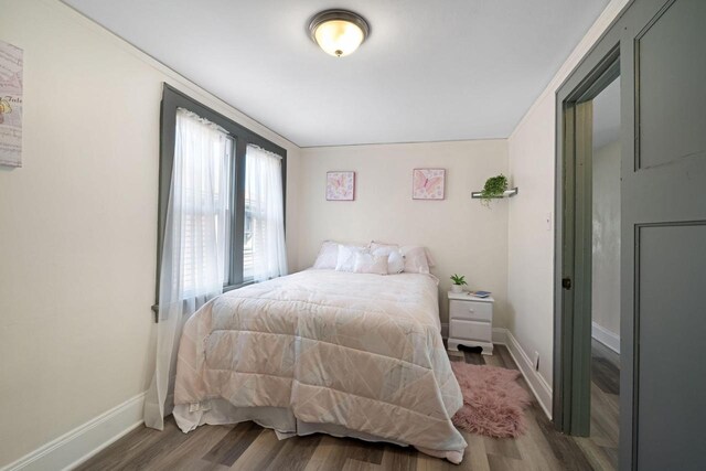 bedroom featuring hardwood / wood-style floors