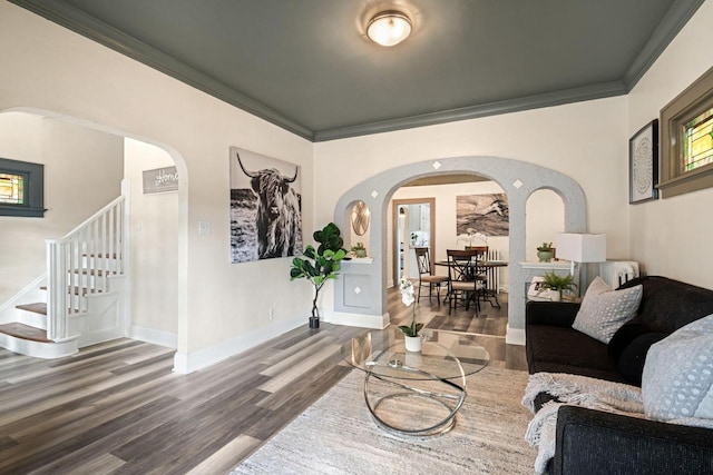 living room featuring ornamental molding and dark hardwood / wood-style floors