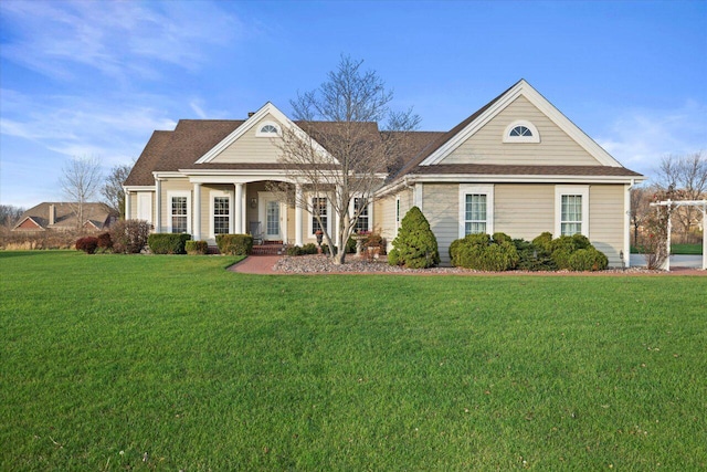 view of front of home featuring covered porch and a front lawn