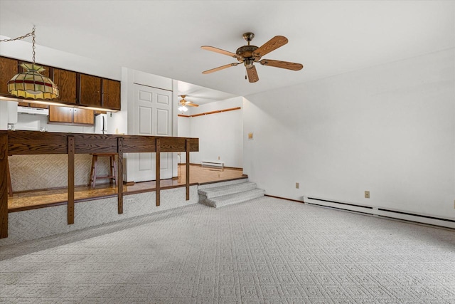 carpeted living room featuring baseboard heating and ceiling fan