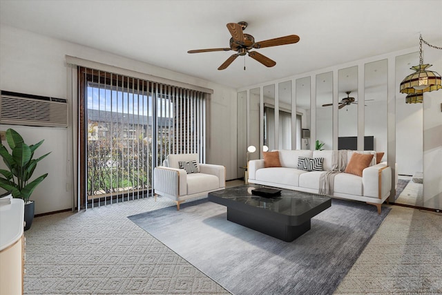 carpeted living room with a wall unit AC and ceiling fan