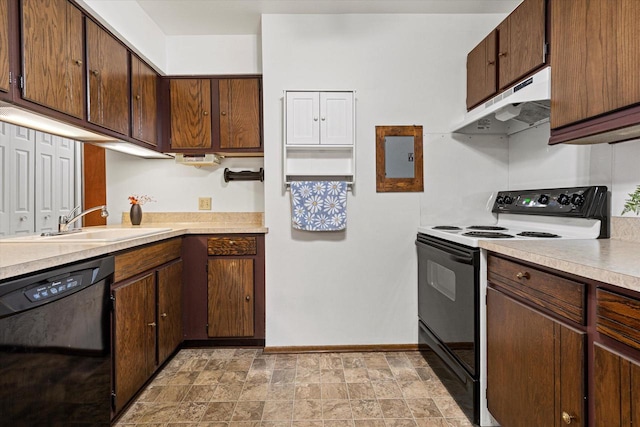 kitchen featuring black appliances, dark brown cabinets, and sink