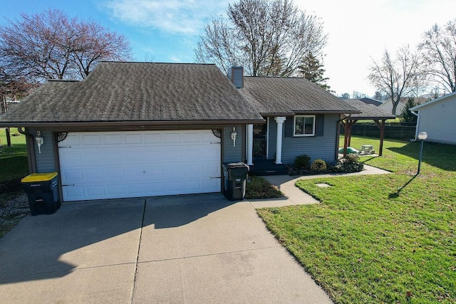 view of front facade featuring a garage and a front lawn