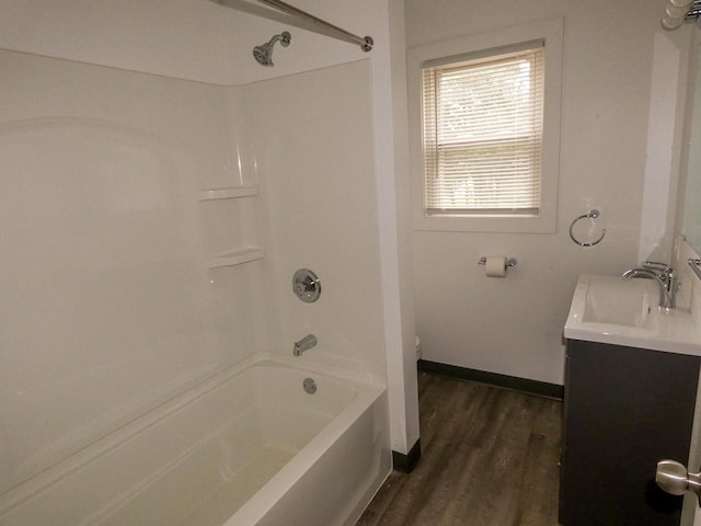 full bathroom with toilet, shower / bathing tub combination, vanity, and hardwood / wood-style flooring