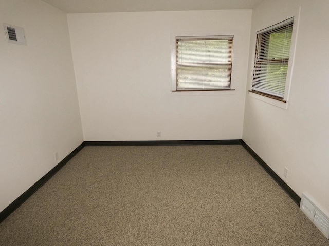 empty room with carpet flooring