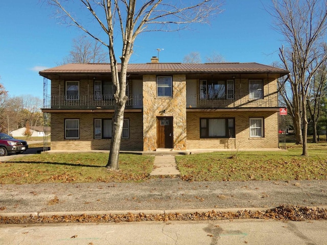 view of front of property with a front lawn