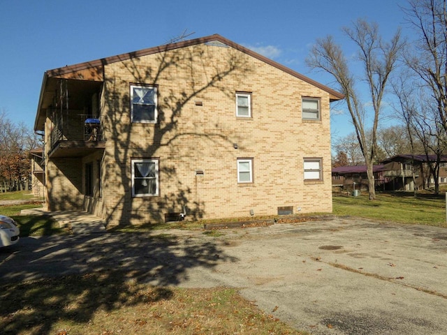 view of property exterior with a balcony