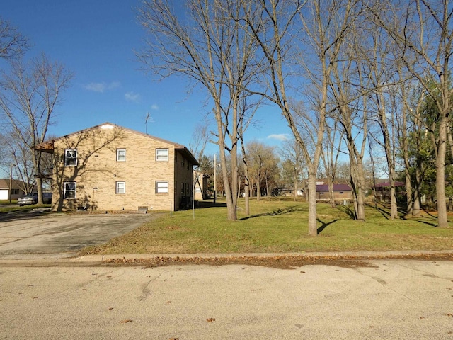 view of side of property featuring a yard