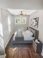 bedroom featuring dark wood-type flooring and ceiling fan