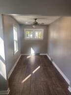 empty room featuring dark hardwood / wood-style flooring