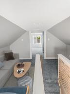 additional living space featuring lofted ceiling