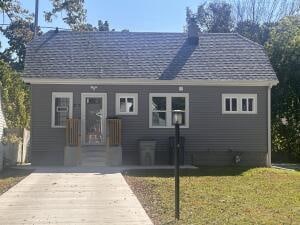 rear view of house with a lawn