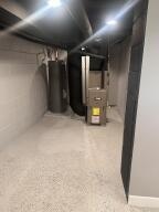 basement featuring water heater