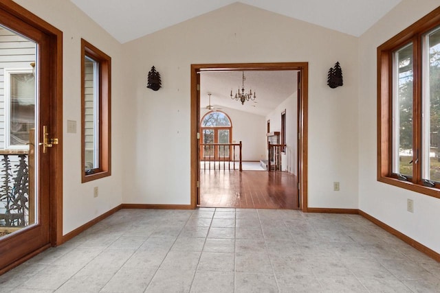 361 Yeoman Ct, Nekoosa, WI 54457 - spare room with vaulted ceiling, a chandelier, and light tile patterned flooring