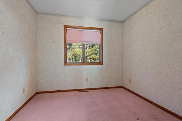 spare room with carpet