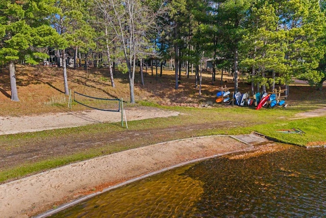 view of property's community featuring a water view and volleyball court