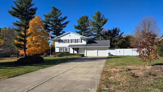 view of front facade featuring a front lawn and a garage