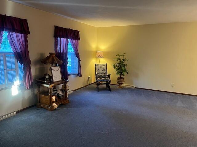 sitting room with carpet flooring and a baseboard radiator