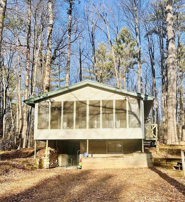 view of front of house with a sunroom