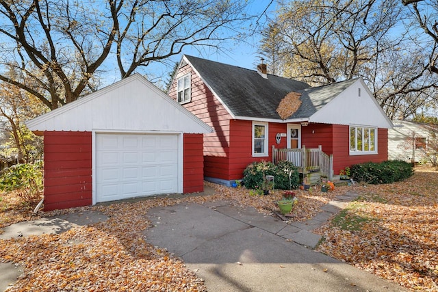 view of front of property featuring an outbuilding and a garage