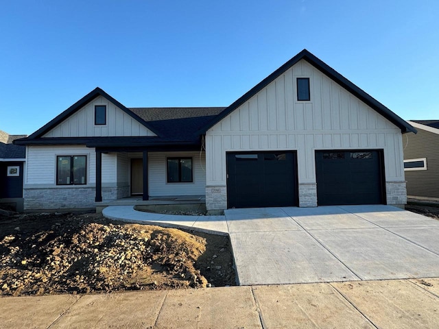 view of front of property featuring a porch and a garage