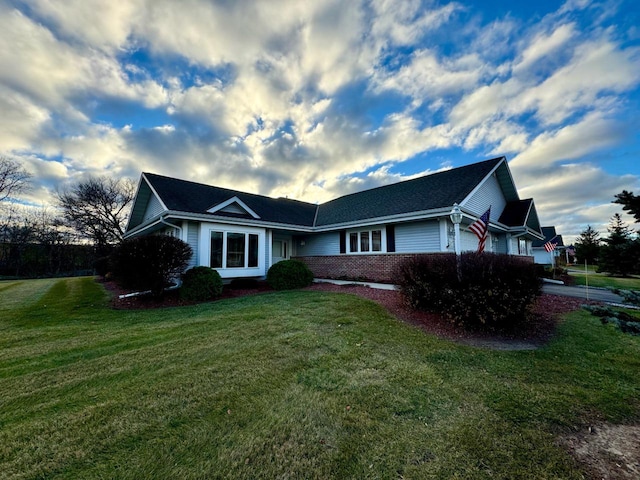 view of front of home with a front lawn