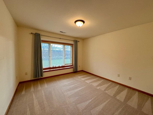 spare room with carpet floors