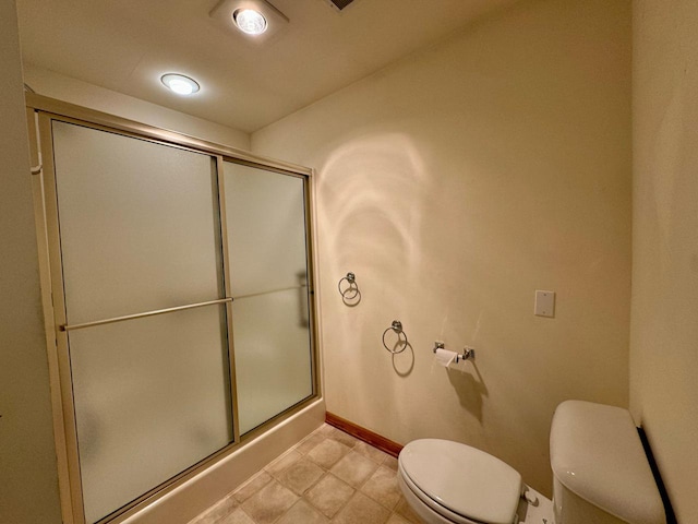 bathroom featuring toilet and walk in shower