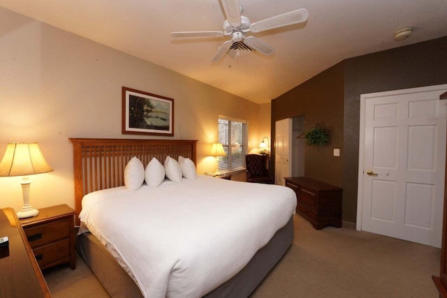 carpeted bedroom featuring ceiling fan and lofted ceiling