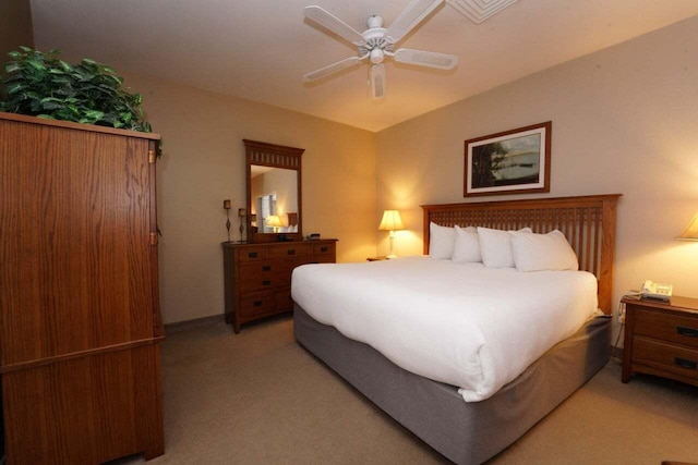 bedroom featuring ceiling fan and light carpet