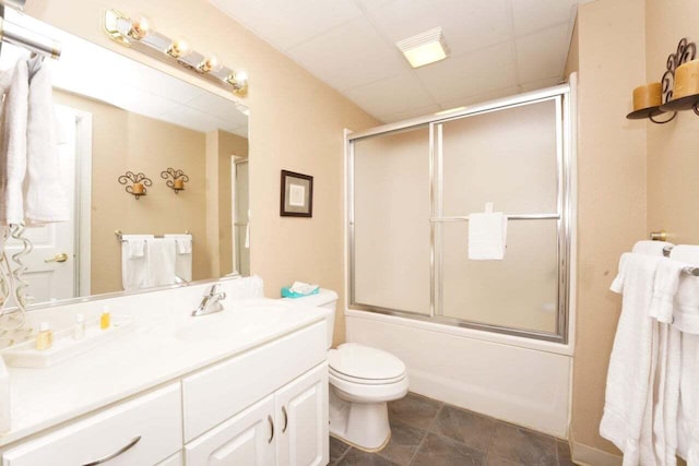 full bathroom with vanity, toilet, and shower / bath combination with glass door