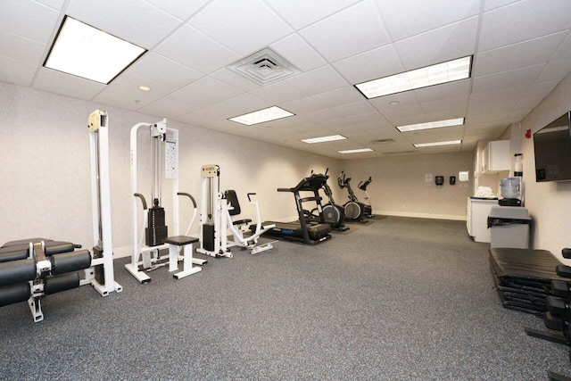 gym featuring a paneled ceiling