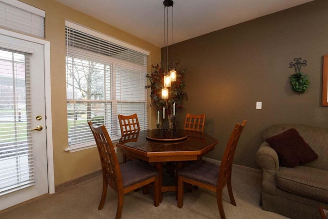 view of carpeted dining area