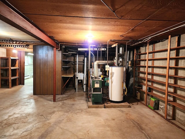 basement featuring gas water heater and sink